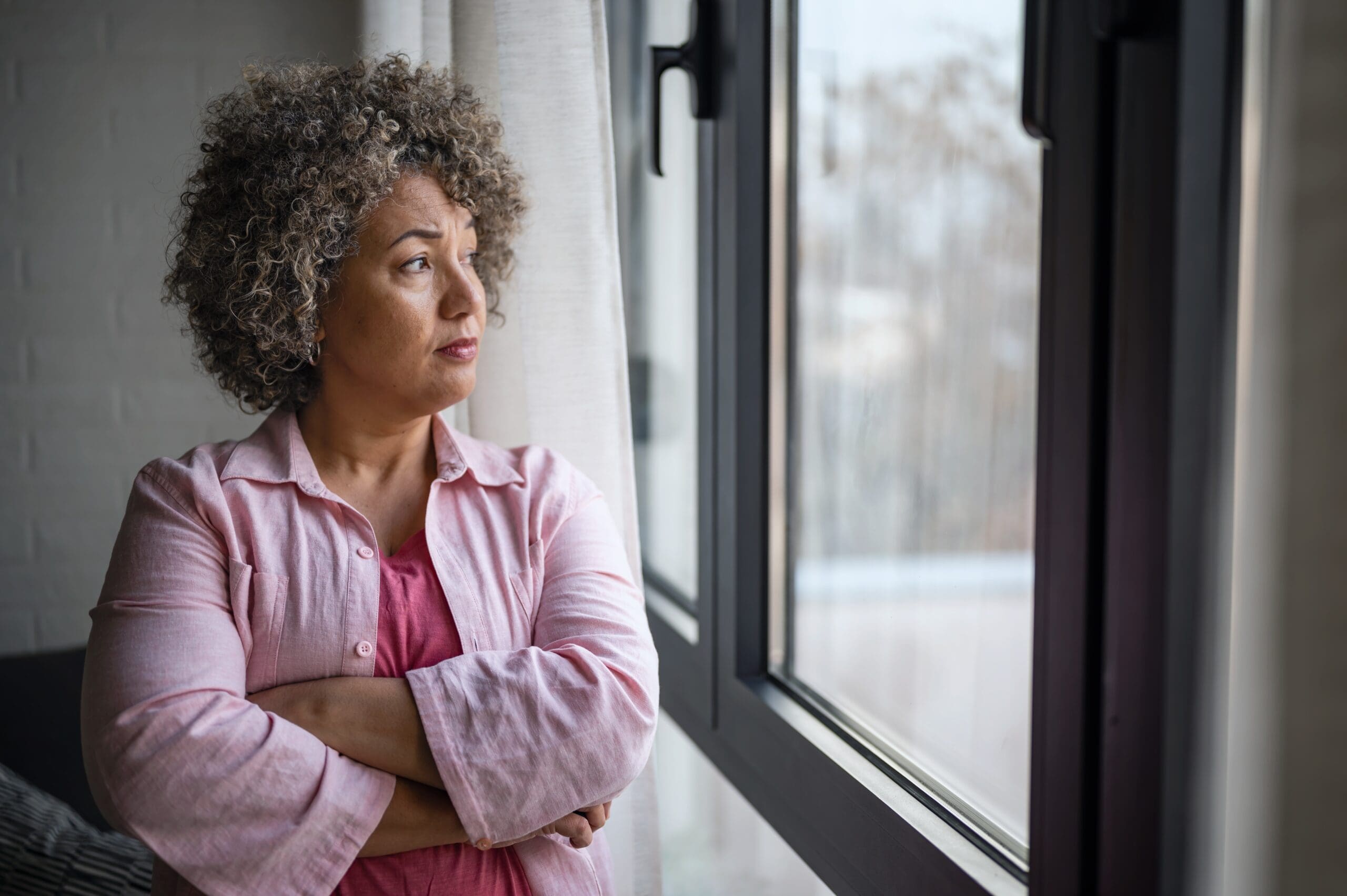 Woman looking out of window