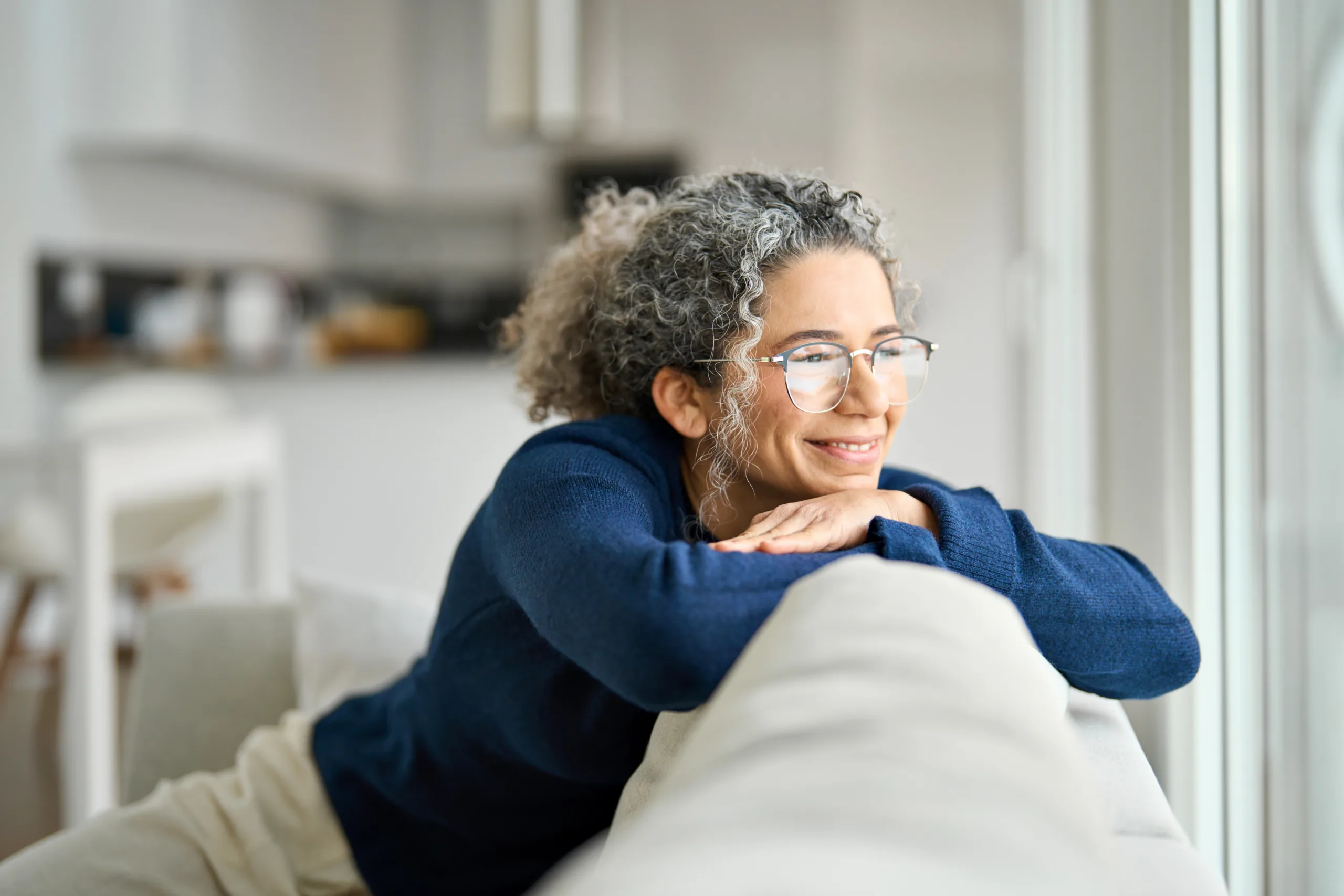 Woman sitting on sofa